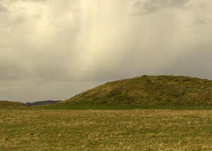 barrow against a skyline