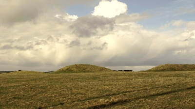 barrows against a skyline